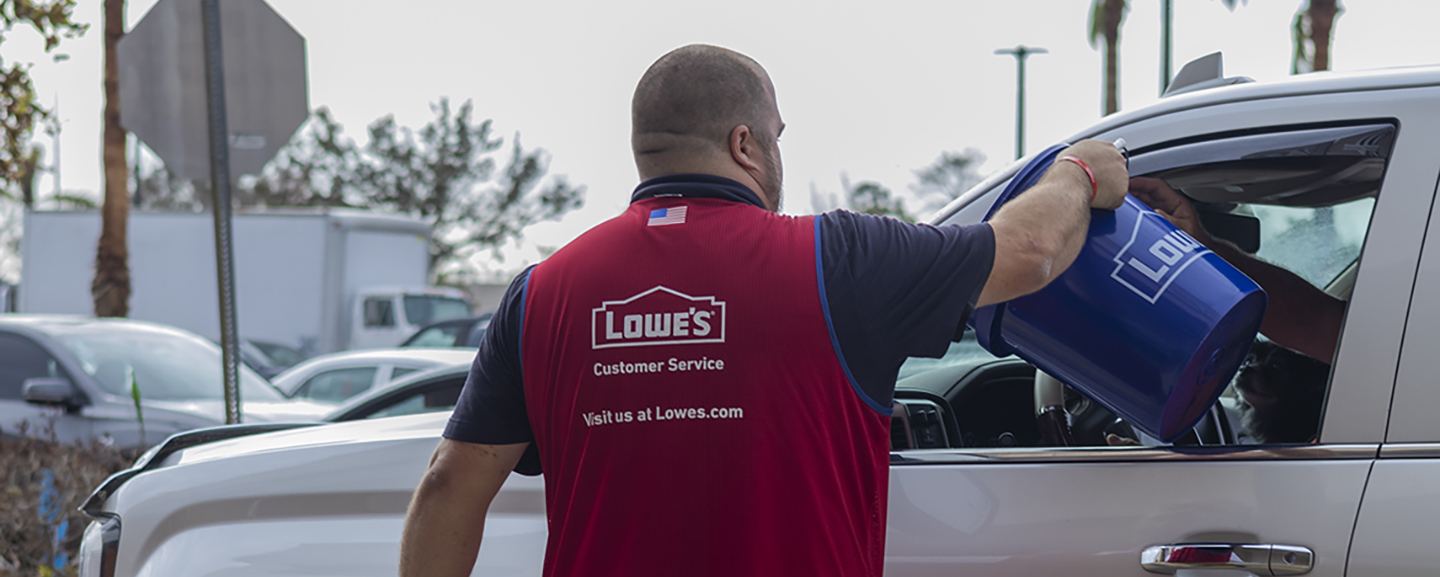 Lowe's associate handing out disaster relief supplies