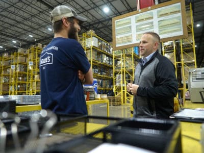 facing-employee-with-rack.jpg
